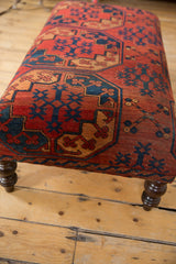Antique Ersari rug fragment corner, bold red, navy geometric pattern, curved leg.