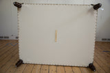 Cotton canvas underside of antique rug ottoman, brass studs, and Old New House tag.