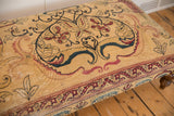 Antique Kerman rug fragment, cochineal red, navy, and charcoal curvilinear pattern.