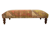 Vintage Oushak Ottoman Table, distressed Turkish rug top with geometric design in muted tones.