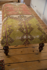 Vintage Turkish rug fragment ottoman side, saffron geometric pattern, distressed finish, dark leg.