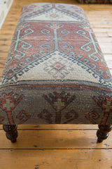 Vintage distressed Turkish rug fragment ottoman, unique geometric pattern in rust, mint, and gray tones.