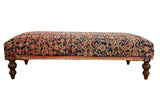 Vintage 1930s Persian rug ottoman coffee table with navy, blush, orange, and ivory unique design.