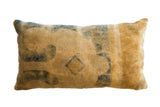 Antique Chinese Rug Fragment Pillow, faded beige with muted blue abstract motifs, soft texture.