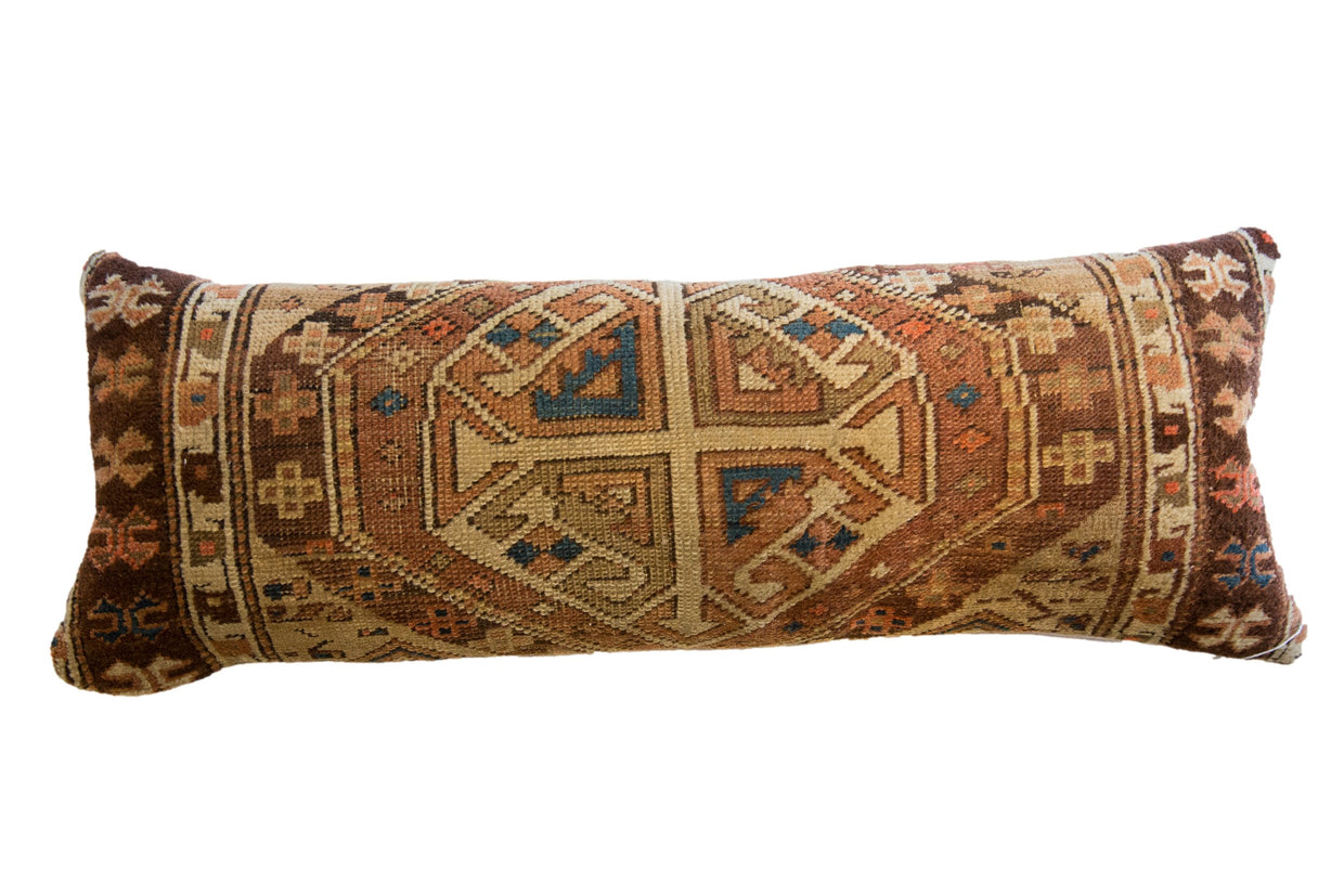 Hand-knotted antique Caucasian geometric pillow in earthy rust, brown, beige, and blue, 13x36.