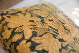Storied golden and deep-toned floral motifs of the antique Kerman rug fragment pillow.