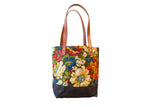 Vintage Floral Fabric Market Tote Bag with colorful 1950s pattern, dark base, and leather handles.