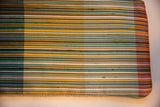 Textured vintage Como fabric with green, yellow, and ivory stripes.