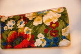 Vintage floral fabric pattern on Southport clutch with red, blue, cream, yellow flowers.