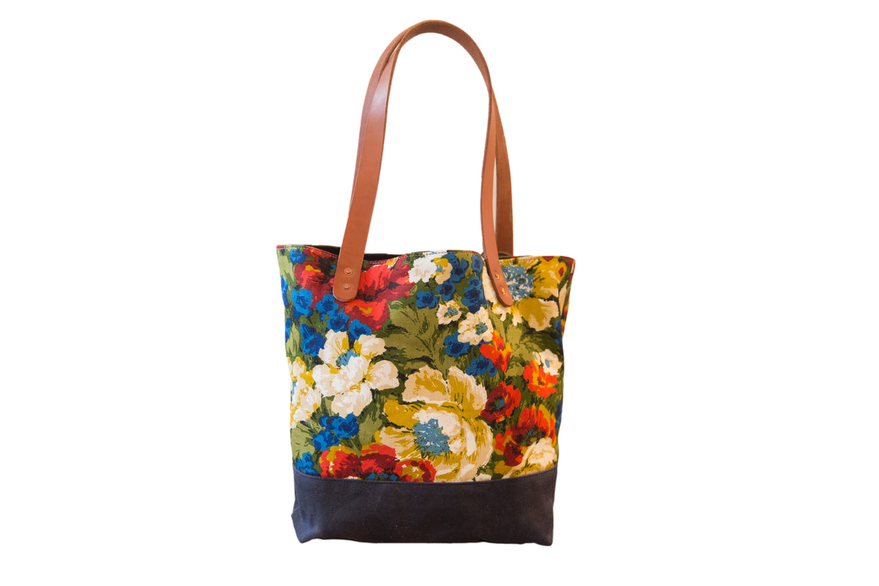 Vintage Floral Fabric Market Tote Bag with colorful blooming pattern and brown leather handles.