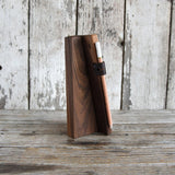 Peg and Awl walnut wood V-shaped chalk tablet stand holding a light pencil with leather loop.