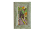 A small painting of a tomato plant with orange flowers, framed in rustic green wood.