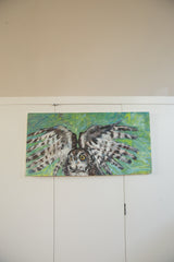 Grace B. Keogh's owl painting with broad, textural wings against a vibrant green.