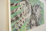 Striking yellow eyes and textured feathers of the Grace B. Keogh owl painting.