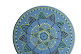 Matt Ulrich Dutch dot painting detail on blue wood, with geometric green, brown, white dot patterns.
