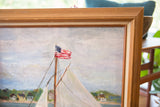 Close-up of American flag on sailboat mast, with textured vintage wooden frame.