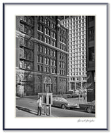 A black and white photograph of 39 Whitehall Street, New York, capturing historic architecture and street life.