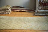 Vintage Turkish Oushak carpet with allover subtle floral design in beige and ivory.