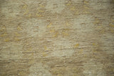 Hand-knotted pile texture with subtle tone-on-tone floral pattern in beige and greige.