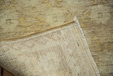 Vintage Oushak carpet's tightly woven foundation and subtle beige, ivory floral pile.