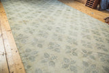 Distressed Oushak rug, blanched texture, faded green lattice clover motif.