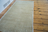 Vintage Oushak runner texture with subtle beige and silver ivory harlequin pattern.