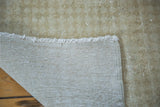 Woven foundation, fine fringe, and subtle tone-on-tone beige pile of the vintage Oushak runner.
