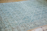 Distressed blanched ocean green blue Oushak carpet with allover lattice design.