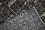 Tightly woven foundation and short fringe of the vintage Afghan rug with brown pile.