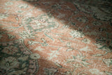 Distressed Oushak carpet, faded blanched rust terra cotta and silver patterns.