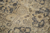 Blanched beige and dark brown pattern detail on vintage Turkish carpet pile.