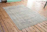 Vintage Oushak carpet in light beige with soft, airy grey and slate blue motifs.