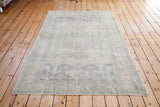 Hand-knotted vintage Oushak carpet with muted beige, grey, and slate blue patterns.