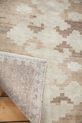 Vintage minimalist Oushak rug with tone-on-tone beige geometric pattern and exposed woven foundation.