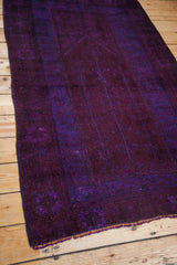 Soft violet purple pile and frayed bottom edge of the vintage Oushak rug.