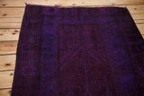 Dense pile texture of the vintage overdyed Oushak rug, blending royal blue and violet purple.