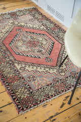 Central brick red geometric medallion of the vintage Oushak rug.