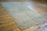 Distressed Sivas runner showcasing faded allover pattern, abrashed sea foam green, and textured fringe.