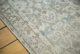 Softened, distressed pile of a vintage Turkish Sivas rug with abrashed sea foam green field.