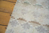 Blanched, distressed pile texture with faded lattice motif on a vintage Oushak rug.