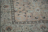 Vintage Kayseri rug's soft beige field displays cloudbands and border pattern.