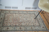 Vintage hand-knotted rug in soft neutral beige, featuring allover cloudband design.