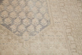 Blanched, airy texture and classic grey design on this distressed Oushak rug.