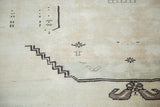 Faded blanched vintage Oushak rug with stepped geometric pattern in ivory and charcoal.