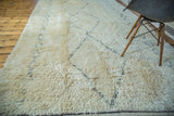 Plush ivory pile of vintage Moroccan rug, highlighting blanched charcoal outlines.