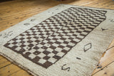 Vintage Moroccan carpet's thick pile with unique brown and cream checkered motif.