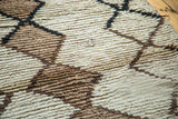 Textured hand-knotted pile of vintage Moroccan rug with ivory, grey, and charcoal lattice.