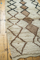 Shaggy pile texture of vintage Moroccan rug with ivory and charcoal black lattice pattern.
