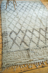 Vintage Moroccan carpet fringe and shaggy pile in blanched ivory and charcoal grey.
