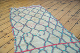 Textured pile of the Moroccan runner, highlighting unusual hot pink and aqua blue lattice motif.
